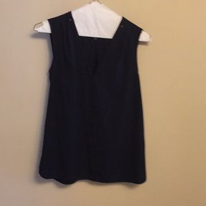 Navy blue V neck sleeveless top with pleated back